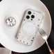 Phone case with colorful design on a white plate with a fork