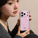 Person holding a pink phone case with a neutral background