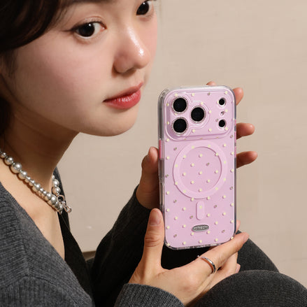 Person holding a pink phone case with a neutral background