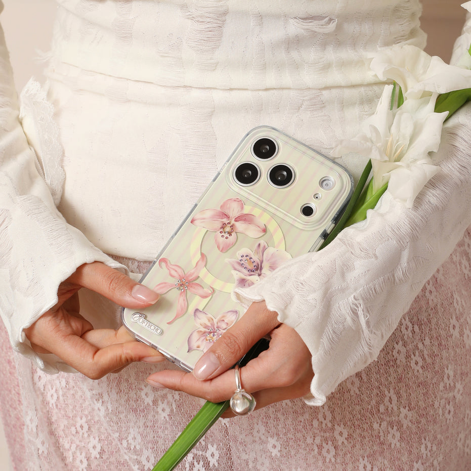 Person holding a phone with a floral case