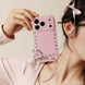 Pink phone case with heart patterns and a bow