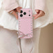 Pink phone case with heart patterns and a bow held by a person wearing a white outfit.