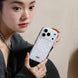 Woman holding a phone case with a clear design