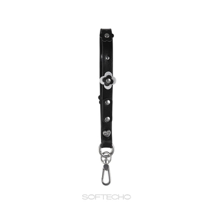 Black leather strap with silver flower charm and hardware on a white background, branded 'SOFTECHO'.