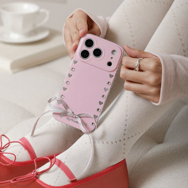 Coquette style blush pink iPhone case with satin bow and crystal details
