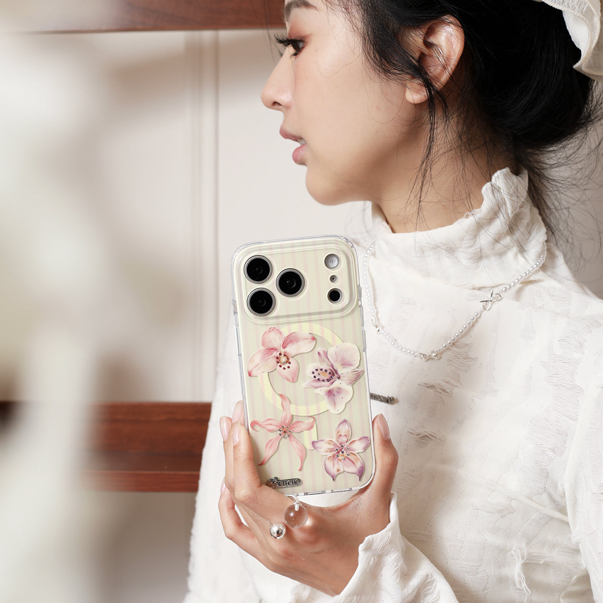 Blush orchid crystal MagSafe iPhone case with floral collage design