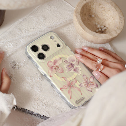 Orchid Whisper iPhone case with layered floral petals and crystal accents