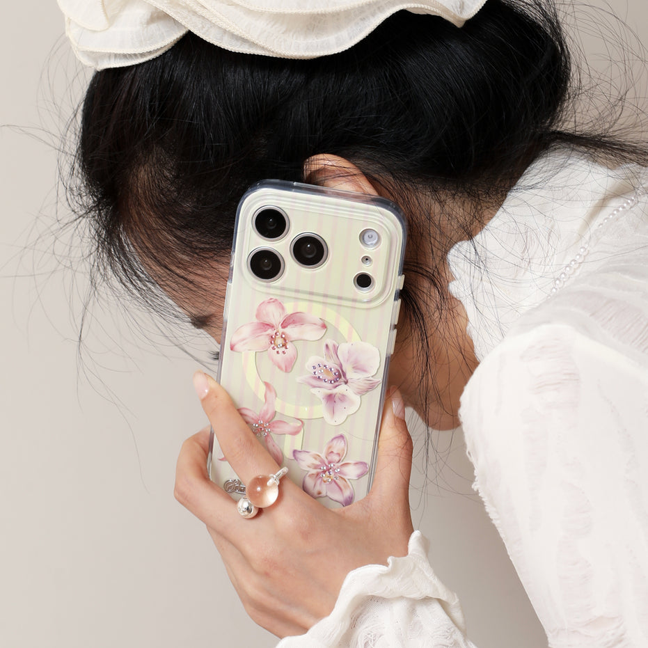 Orchid Whisper iPhone case with layered floral petals and crystal accents