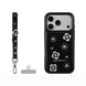 Black phone case with floral designs and accessories on a white background